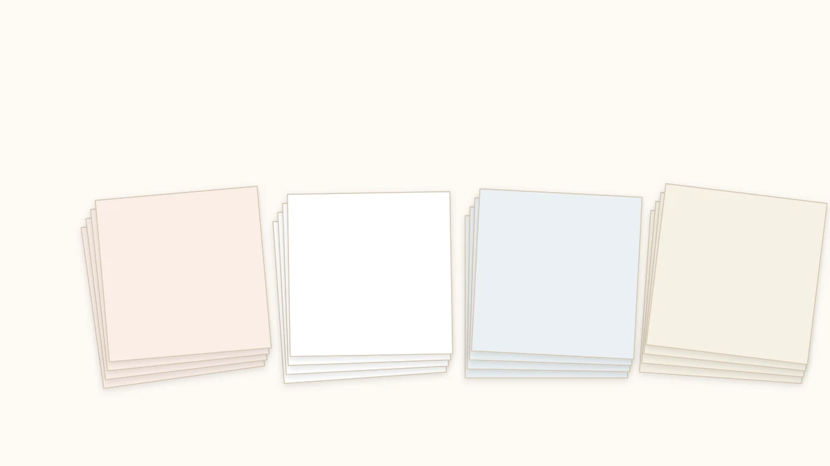 Stacks of different papers for origami: colored kami, white printer paper, tissue paper, and patterned paper