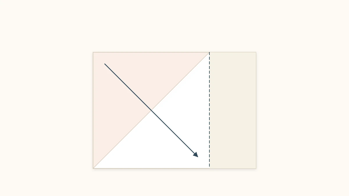 Sheet of paper folded on the diagonal with the excess strip marked for cutting