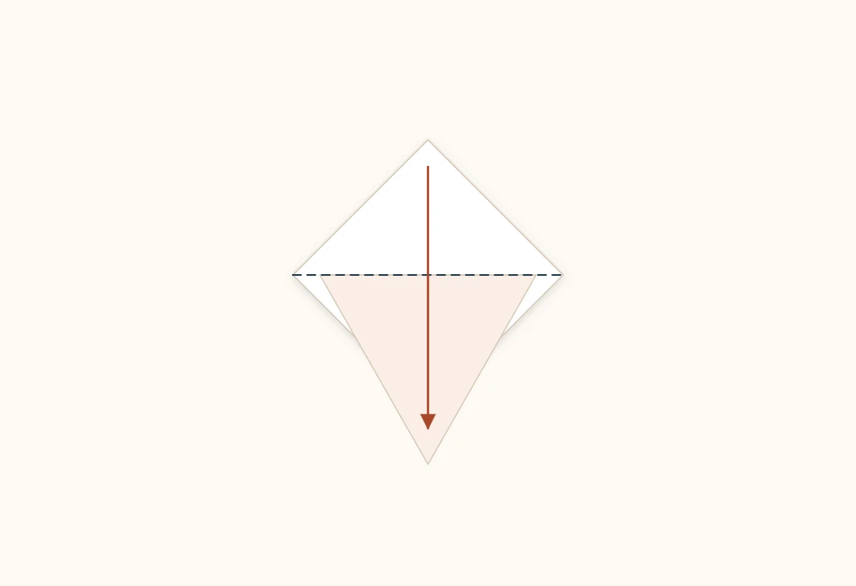 A paper diamond with its top point being folded down past the edge