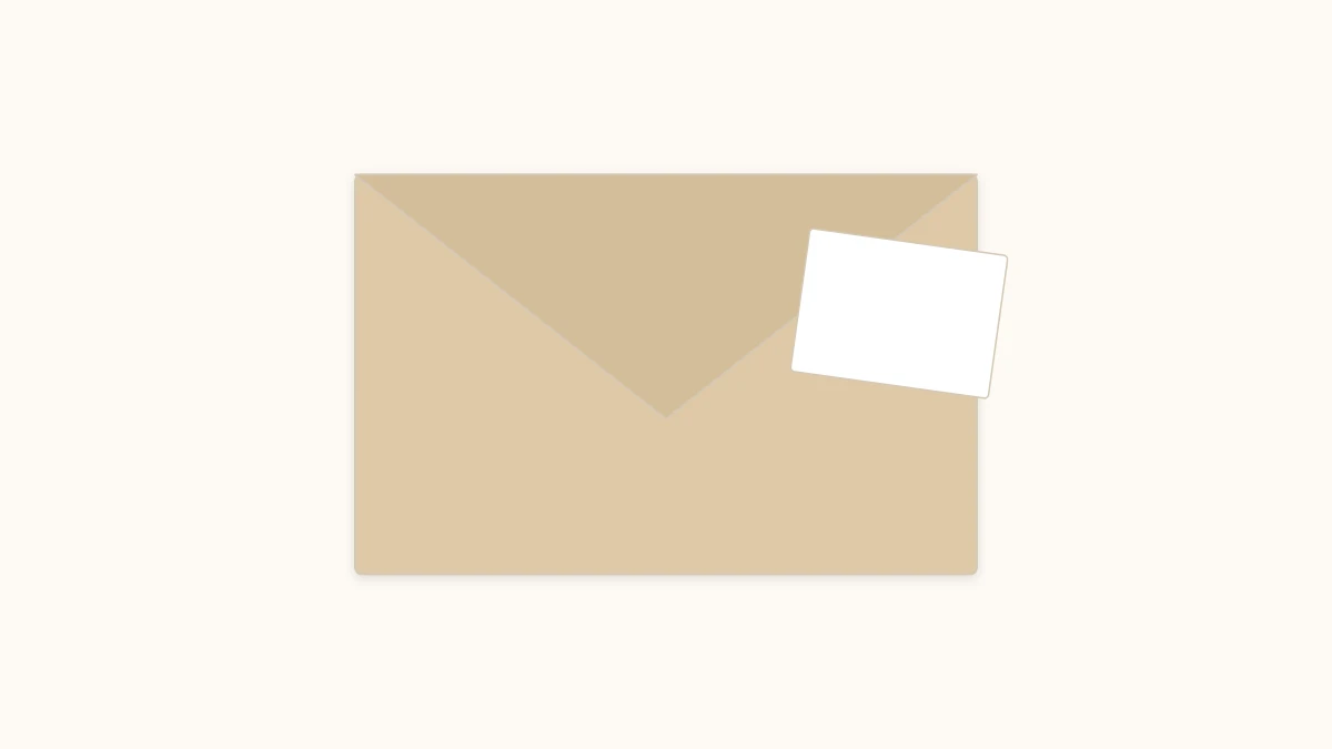 Closed origami envelope in kraft paper with a note peeking out