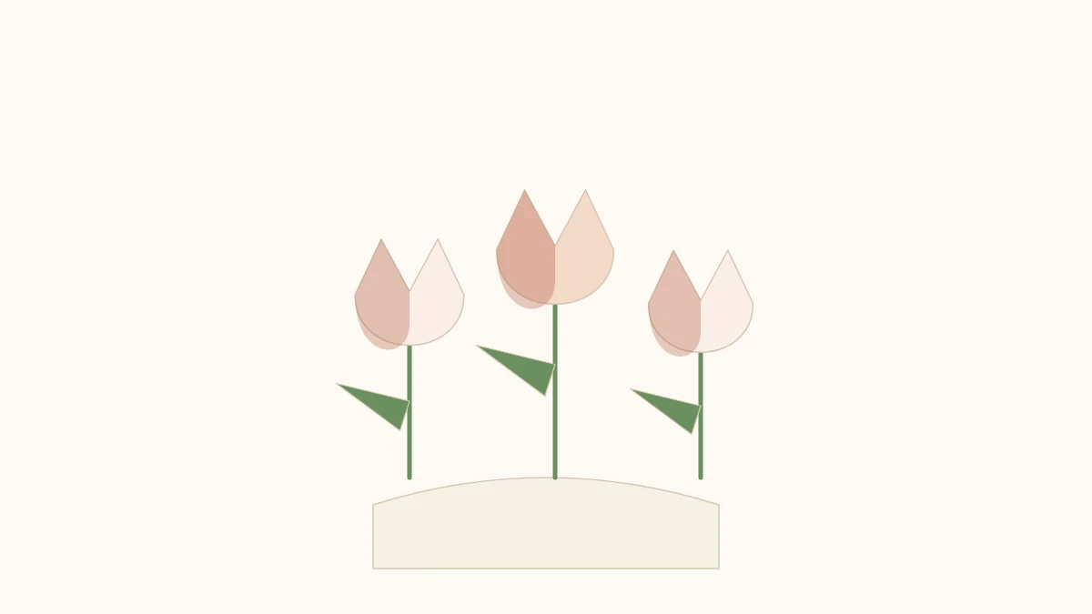 Three red and yellow origami tulips with green stems, resting in a low vase